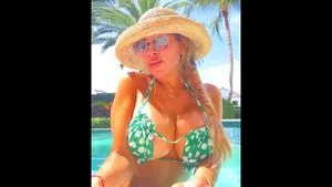 Olga Loera bouncing her tits in a bikini by the pool