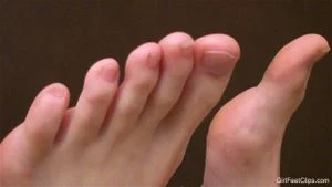 Cute girl shows her bare feet