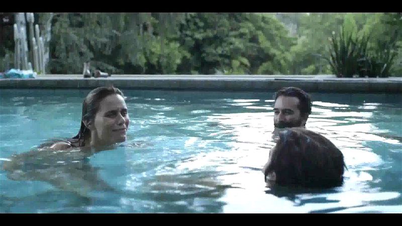 boy and girls play in the pool