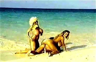 BIG BOOBS AT THE BEACH BIG BOOBS AT THE BEACH