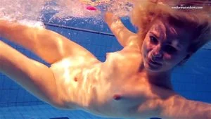 Elena Proklova spreading legs underwater