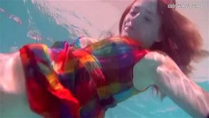 Redhead baby Nikita Vodorezova gets naked fast underwater
