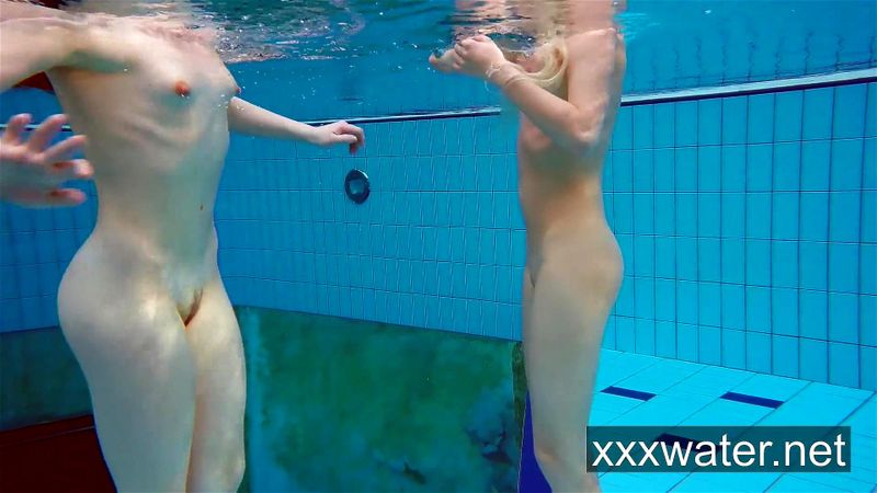 Milana and Katrin strip eachother underwater