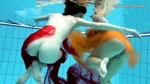 Two hotties submerged underwater