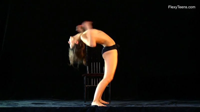 Naked gymnast Kim Nadara doing gymnastics on chair Naked gymnast Kim Nadara doing gymnastics on chair