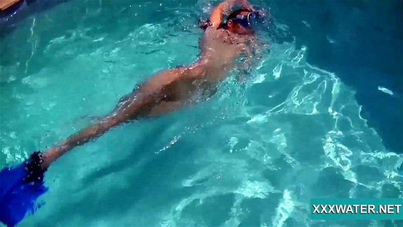 Sexy Candy swims and strips nude underwater