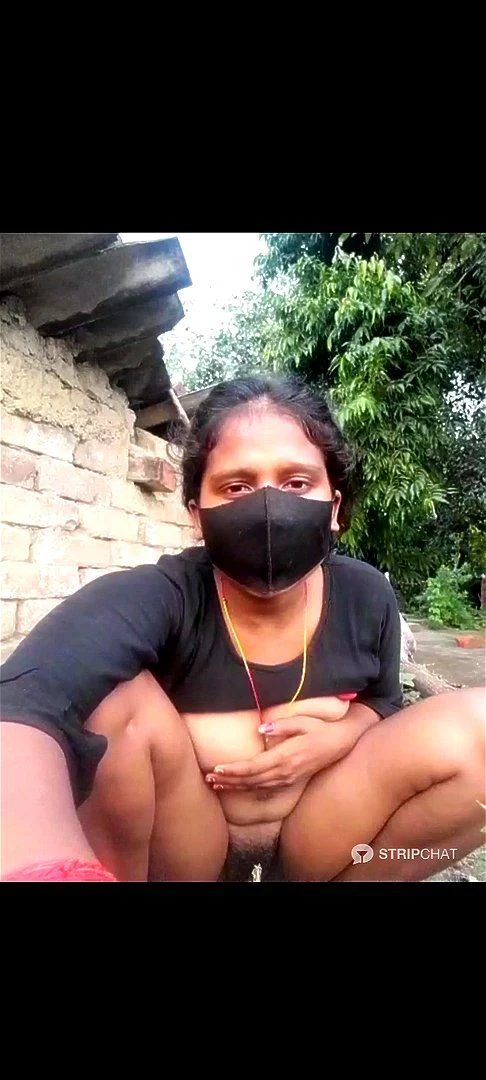 Worried Indian village girl shows tits pussy and ass sitting on a rock behind a building