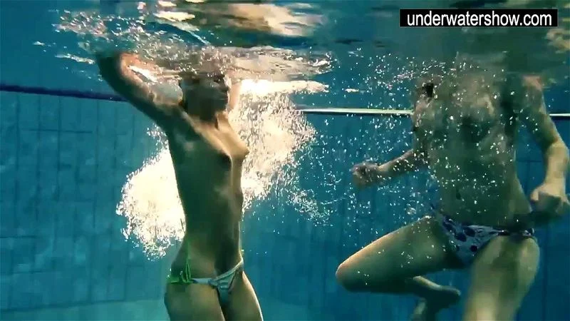 Two sexy amateurs showing their bodies off under water