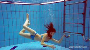 Tight blue swimsuit babe Martina in the pool