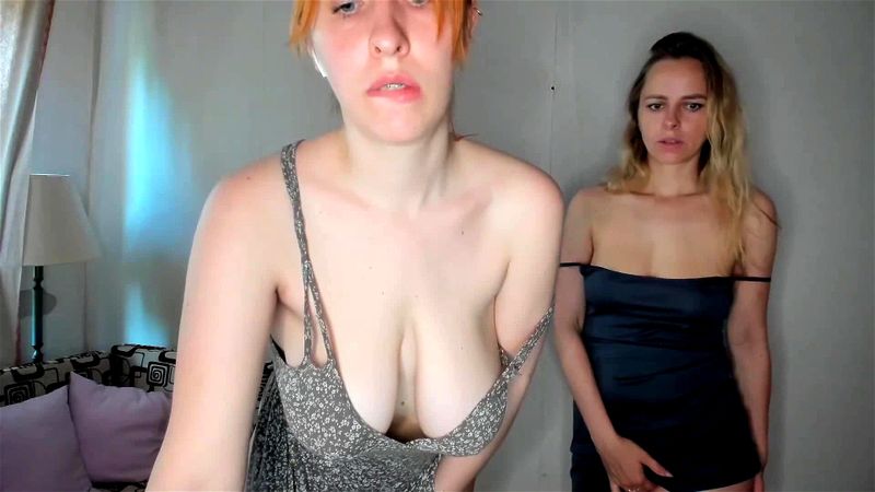 Two busty babes stripping and teasing on cam