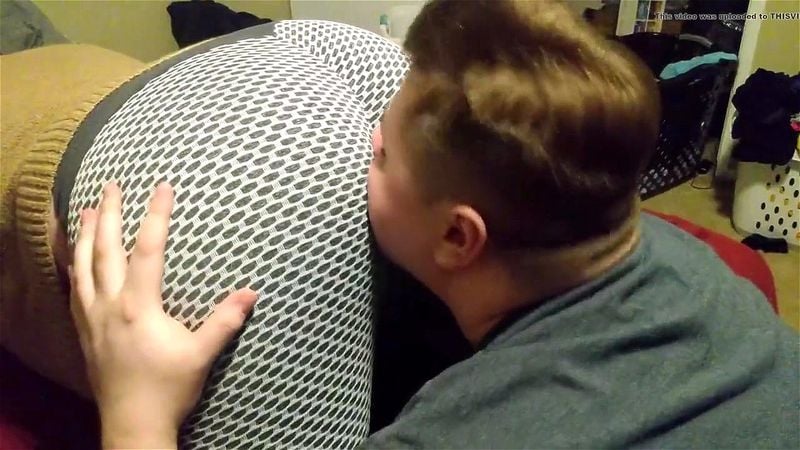 Woman in leggings farting in boy's face Woman in leggings farting in boy's face