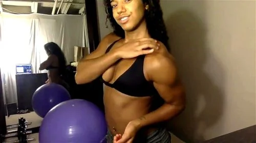 muscular girl flexing on cam