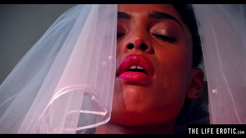 Ebony bride wears her veil while she fucks herself with a bottle