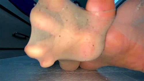 Closeup of her stinky nylons feet