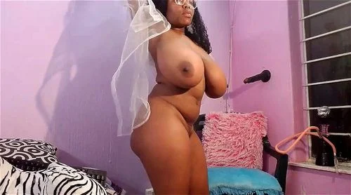 Sexy African cam girl with big tits rides dildo