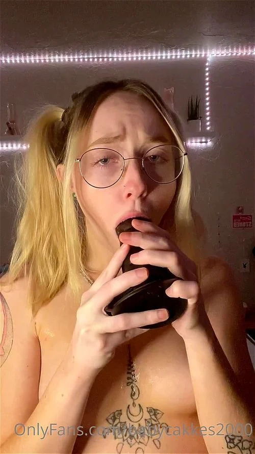 College girl practicing sucking on a BBC dildo