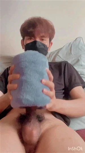 Asian boy jerking with towel