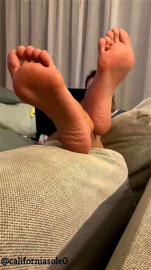 Amateur soles propped up on couch