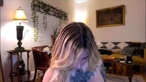 Hot tattooed blond shemale with a huge ass and jugs
