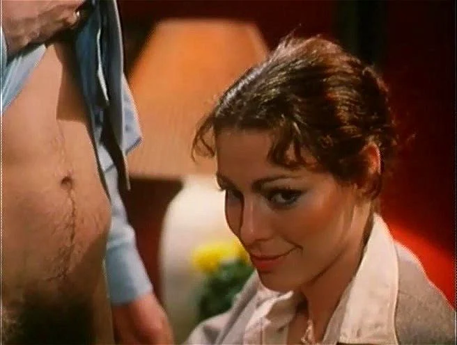 Annette Haven is a successful executive who orders her secretary to suck her cunt, take his cock out for her to suck, and stick it in her pussy to satisfy her