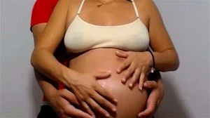 Pregnant Couple rubbing belly