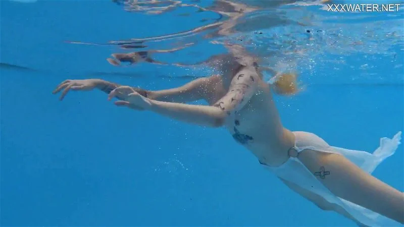 Finnish babe swims nude in the pool