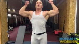 Bodybuilder Showing Off In The Gym