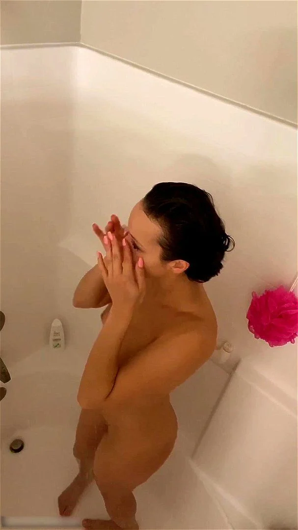 Beautiful women filiming herself while showering and bathing