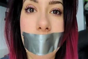 Woman tape gagged