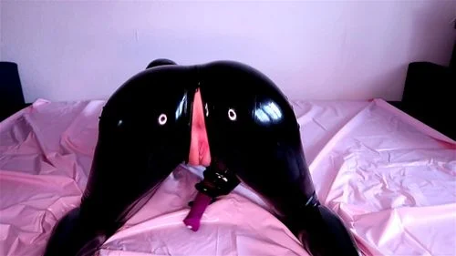 Latex doll wiggles around in bed