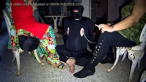 Two mistress using their slave as an ashtray