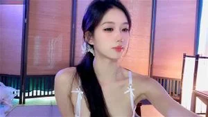 Hot Asian babe teasing on cam