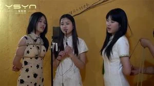 Three girls bound singing