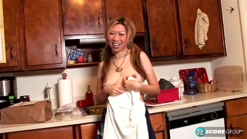 Veronica diddles her tight cunt in her kitchen with a vibrator.