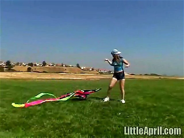 Cute Little April Outdoors Sucking A Popsicle