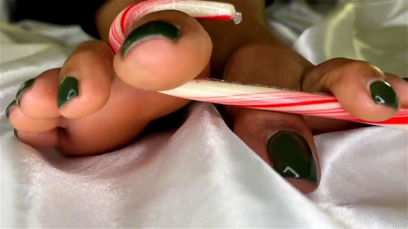 Ebony Girl Breaks Candy Cane with Her Toes