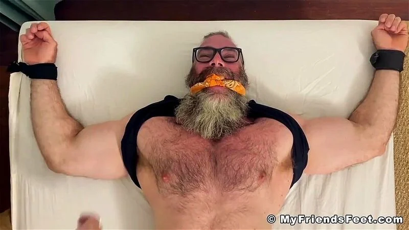 Bearded hairy hunk daddy Rick has his bare feet tickled