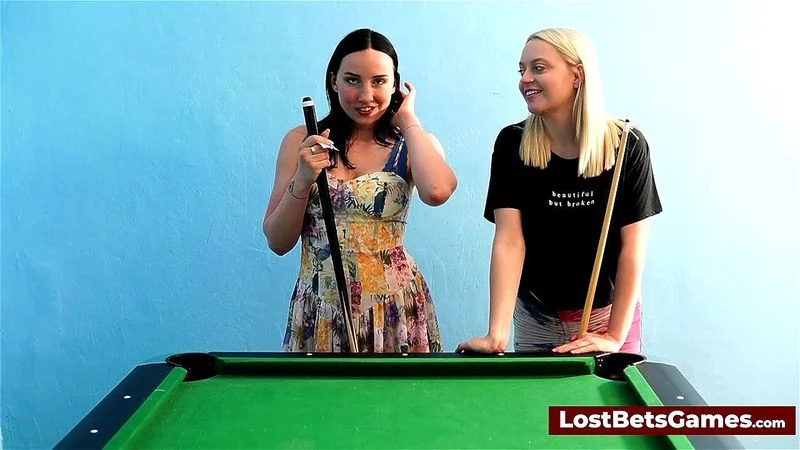 A blonde and a brunette playing a strip billiard sex game