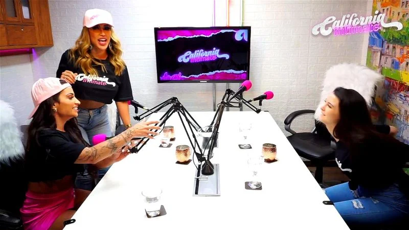 Flavia Oliver performs oral sex on Natasha Steffens during the recording of the California Podcast