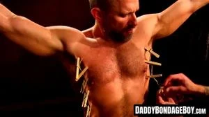 Soldier Dirk endures clothespins on muscled flesh