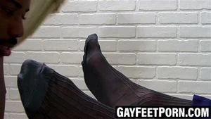 Suited gent enjoys black worshipper's tongue