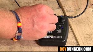 Sub Alex Faux's impressive cock tied up and electrified for kinky play