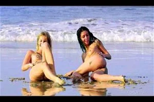 two naked girls on beach