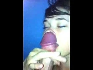 Cutie jerks a cock on her face