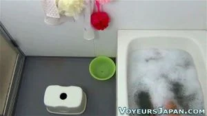 Bathing asian masturbates
