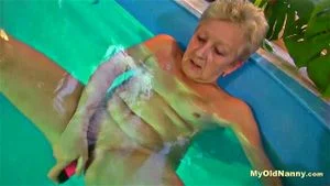 Nanny Rubs Her Pussy in a Pool