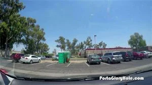 Girl finds porta potty with gloryhole inside and starts sucking off strangers