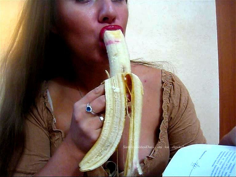 foreigner eats banana at work