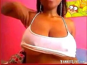 Big titty black babe stripteasing and seducing on webcam while playing with her big melons