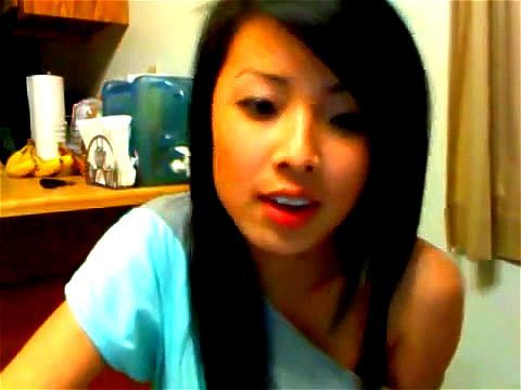 Asian cutie teases on a webcam